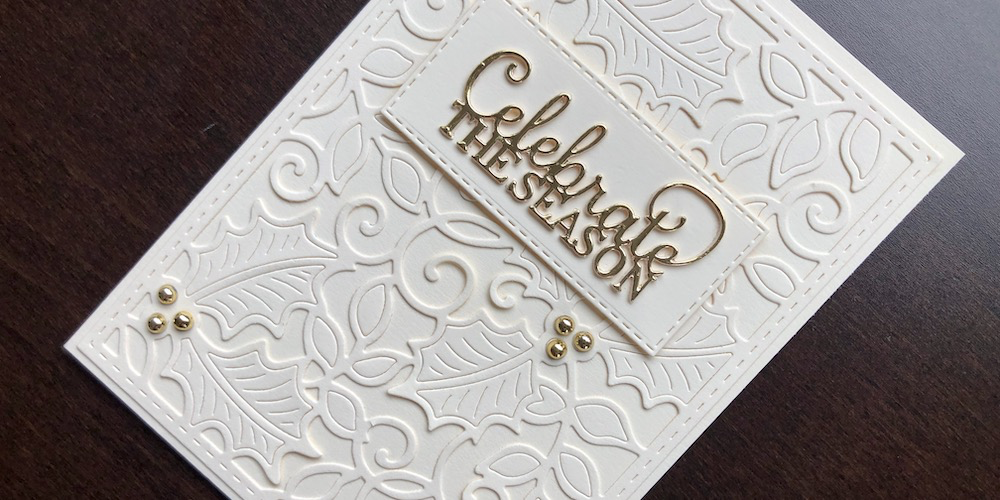 Hand made cream and gold Christmas card with die cut holly background